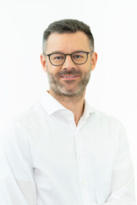 Portrait of Kaj Burchardi, Managing Director at BCG Platinion, delivering a keynote at Dutch Blockchain Week 2026 in Amsterdam.