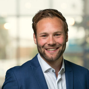 Portrait of Thomas Attema, Senior Researcher at CWI and TNO, delivering a keynote at Dutch Blockchain Week 2026 in Amsterdam.